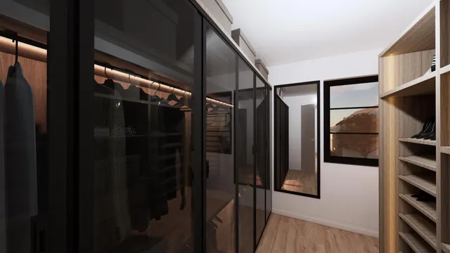 a view of walk in closet with clothes and shoes