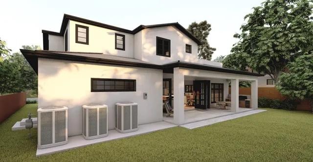 a view of a house with a backyard and a patio