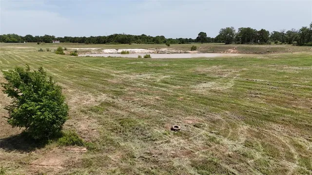 a view of a lake with houses in the background