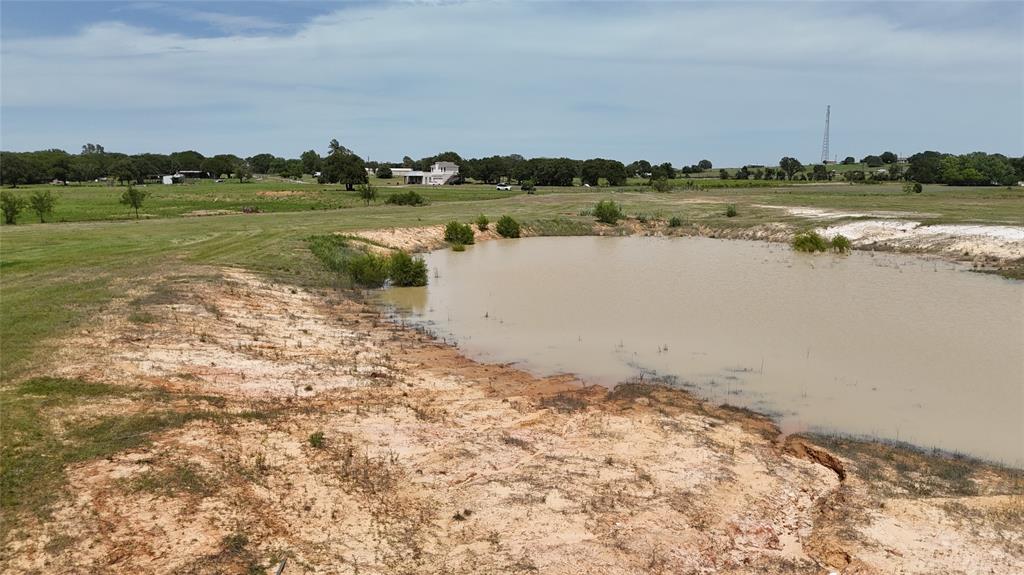 8605 West Highway 199 Springtown, TX 76082 - Photo 18 of 23 a view of a lake with houses in the back