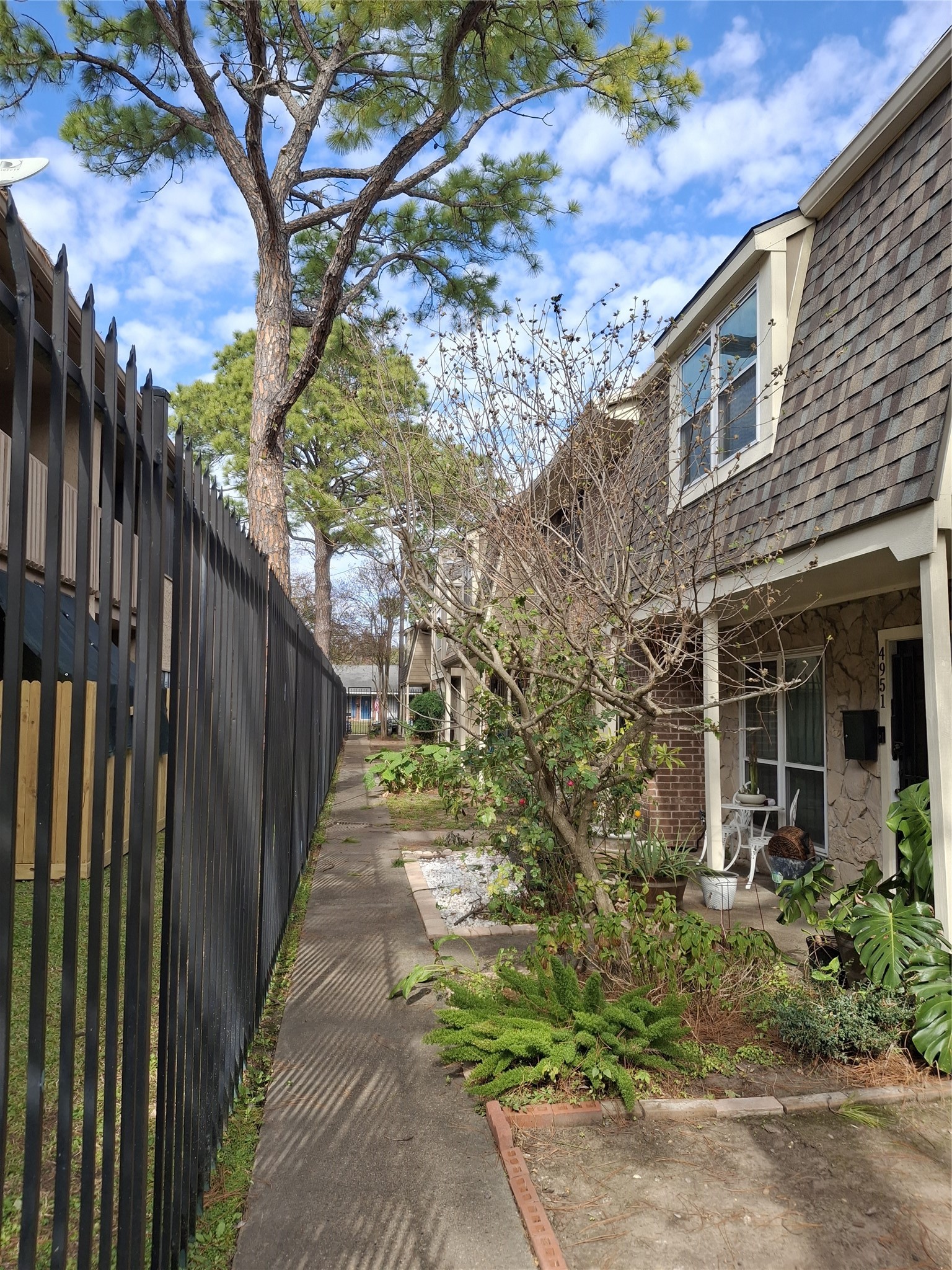 4953 Lamonte Lane Houston, TX 77092 - Photo 2 of 6 a pathway of a house with a yard