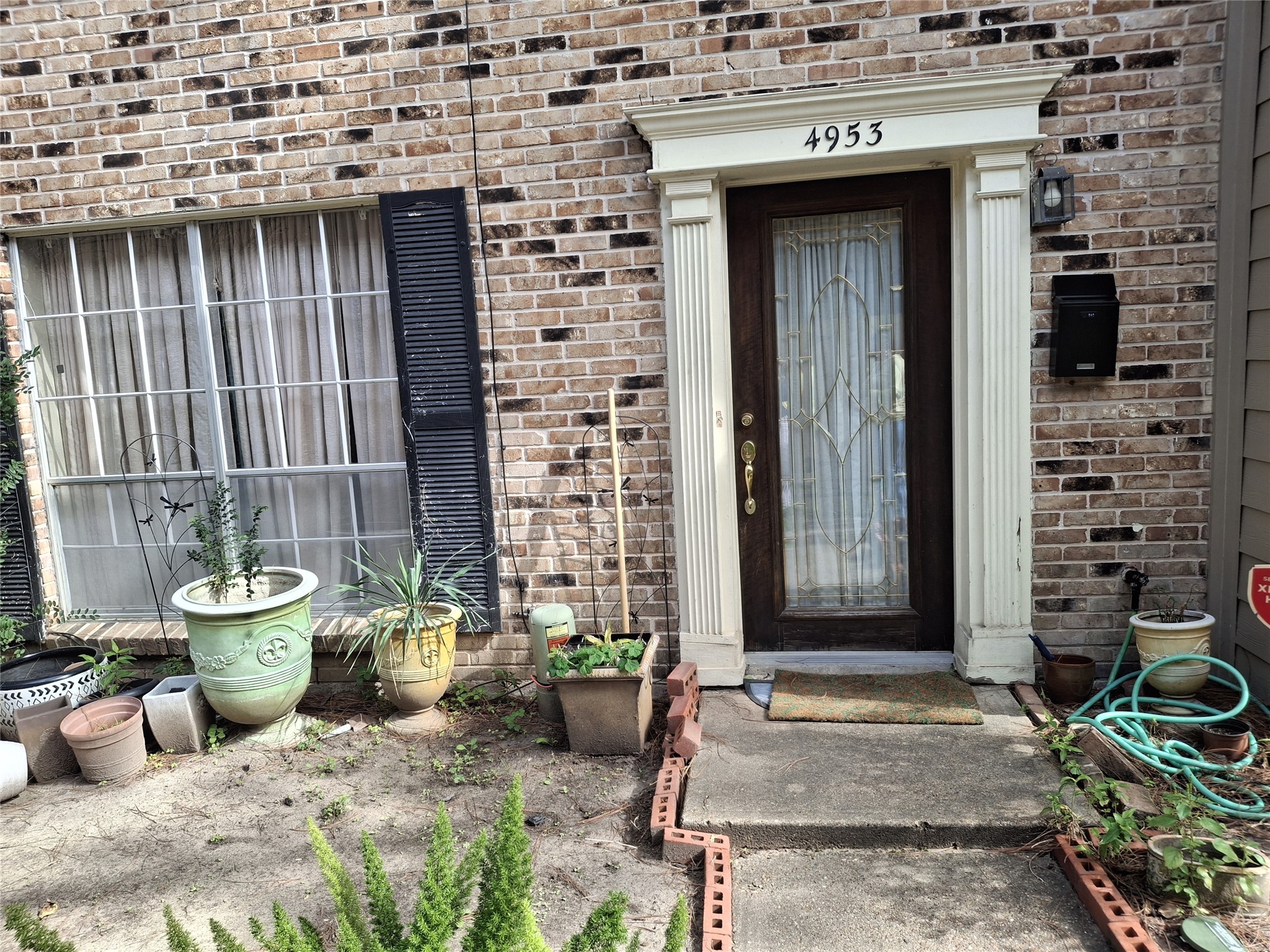 4953 Lamonte Lane Houston, TX 77092 - Photo 6 of 6 a view of a patio with couple of cars parked in front of house