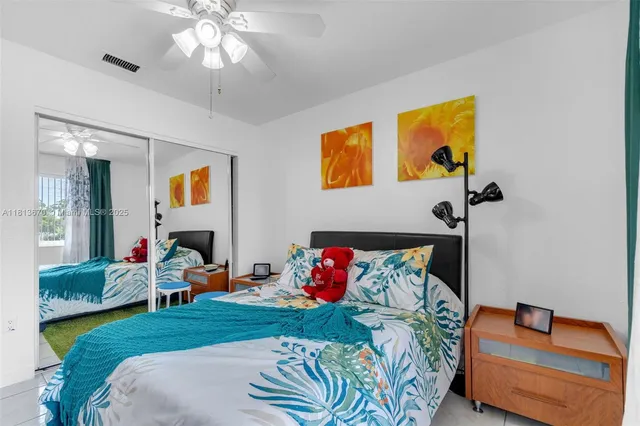 a bed room with a bed and a chair