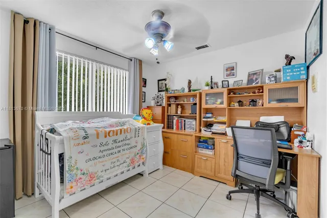 a bedroom with a bed and a book shelf