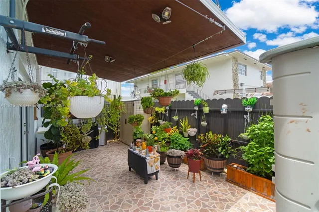 a view of a chairs and table in a patio