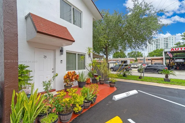 a view of a house with a yard and sitting area