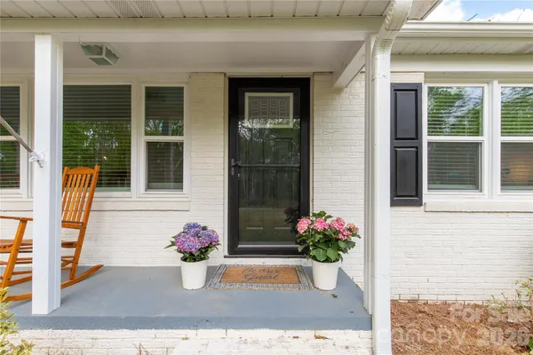 front view of a house with a potted plant