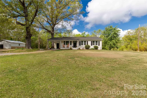 a view of a house with a big yard