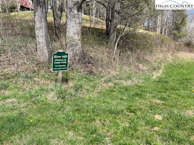 Lot #12 River Spring Road Sugar Grove, NC 28679 - Photo 15 of 21 a sign broad in front of the red tree