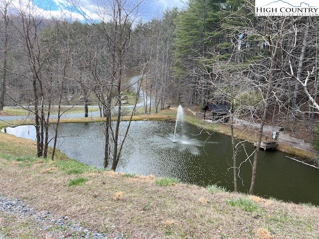 Lot #12 River Spring Road Sugar Grove, NC 28679 - Photo 18 of 21 a view of a yard with wooden fence