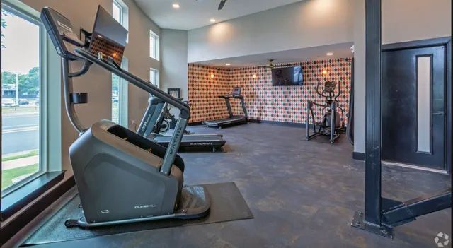 a kitchen with stainless steel appliances granite countertop a sink refrigerator and microwave