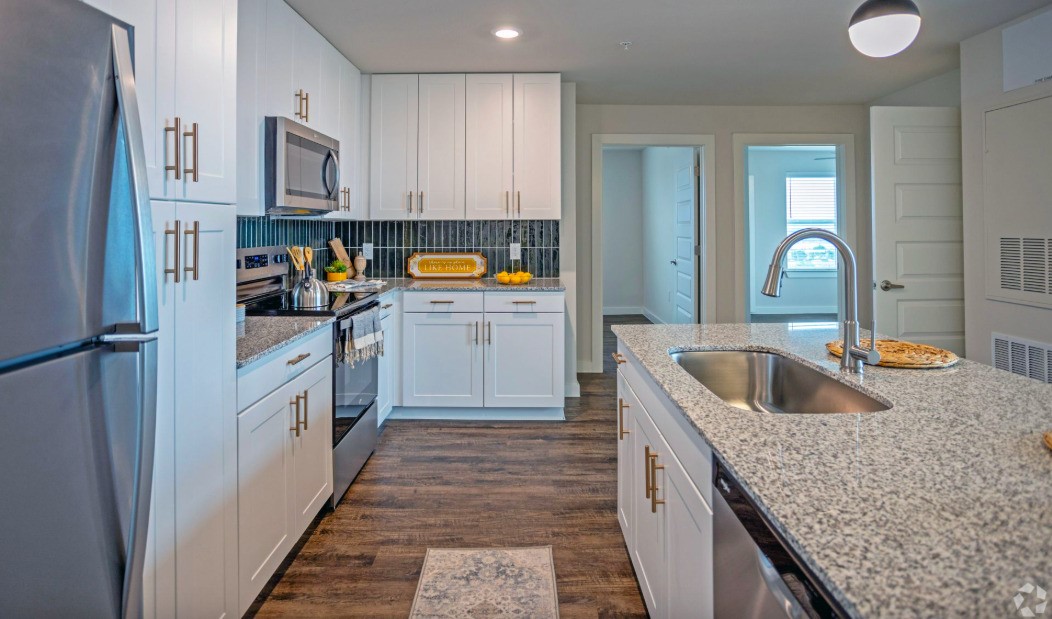 10010 North Capital Of Texas Highway Austin, TX 78759 - Photo 14 of 22 a kitchen with cabinets a sink and dishwasher