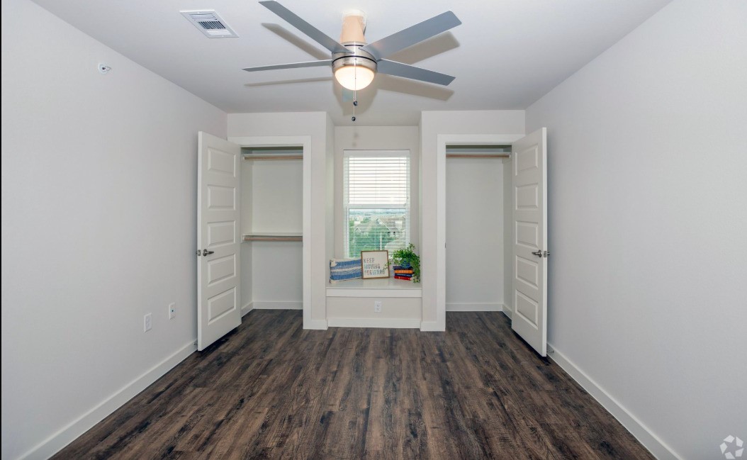 10010 North Capital Of Texas Highway Austin, TX 78759 - Photo 18 of 22 wooden floor in an empty room with a window