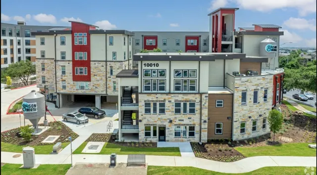 a front view of a building with garden