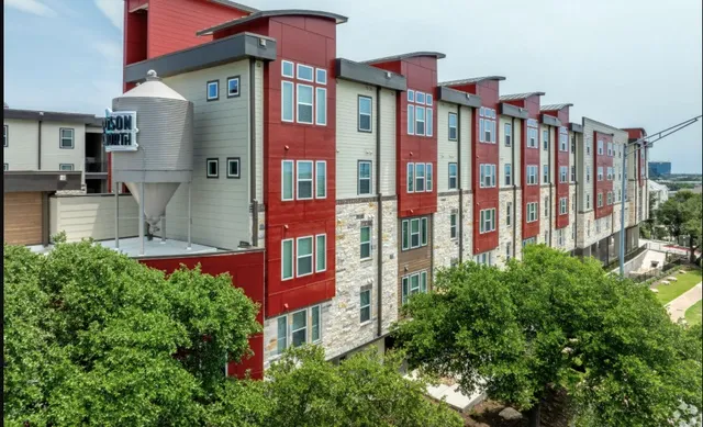 a living room with fireplace furniture and a flat screen tv