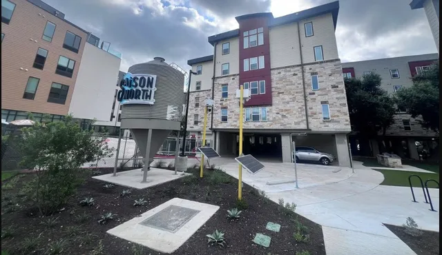 a dinning table and chairs in front of a building