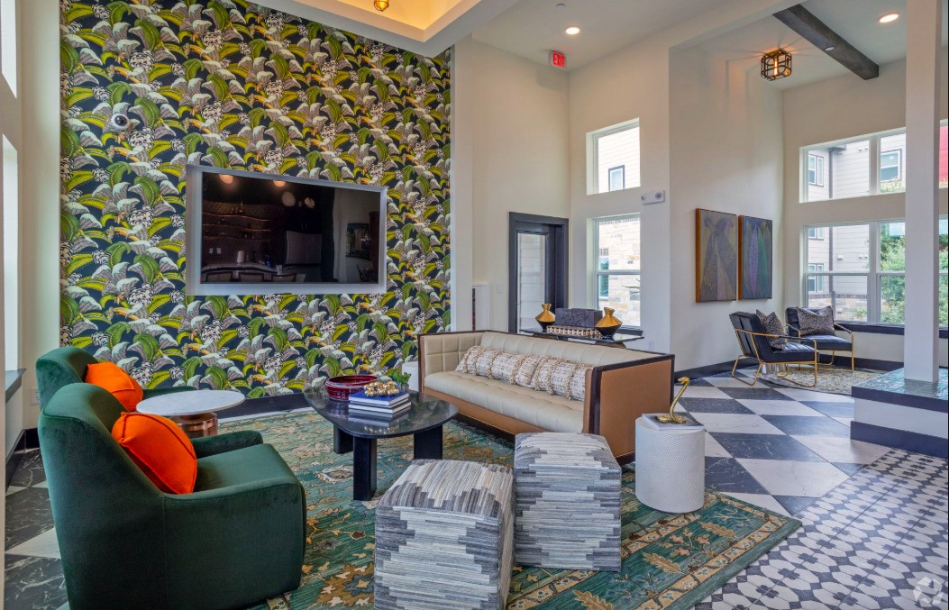 10010 North Capital Of Texas Highway Austin, TX 78759 - Photo 6 of 22 a living room with fireplace furniture and a flat screen tv