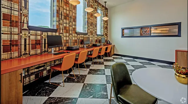 a view of a backyard with table and chairs and potted plants