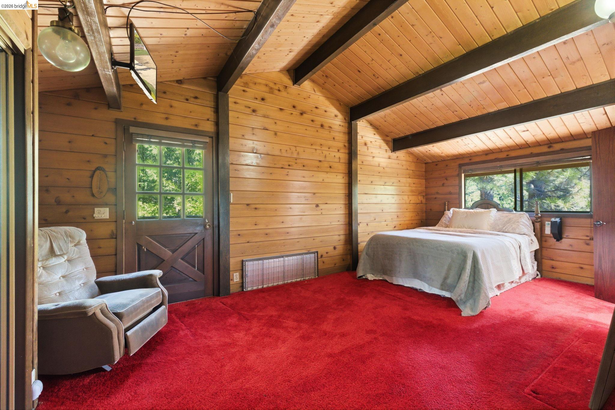 22555 South Fork Road Sonora, CA 95370 - Photo 20 of 35 a bedroom with a bed and wooden floor