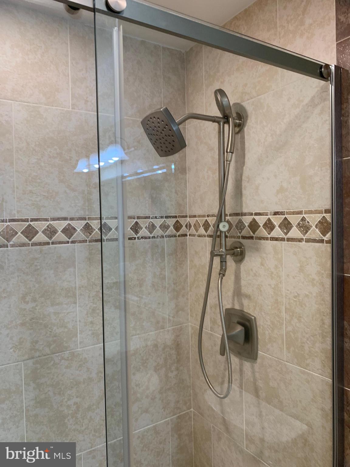 12000 Market Street, Unit 483 Reston, VA 20190 - Photo 20 of 36 Primary bath multiple shower heads