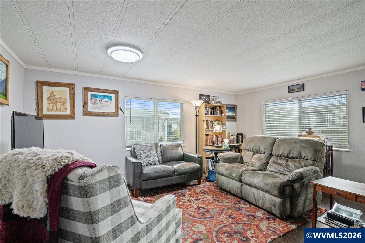 5422 Portland Road Northeast, Unit 123 Salem, OR 97305 - Photo 10 of 23 a living room with furniture and a large window