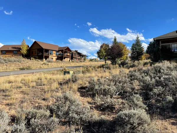 a view of a lake with a house in the background