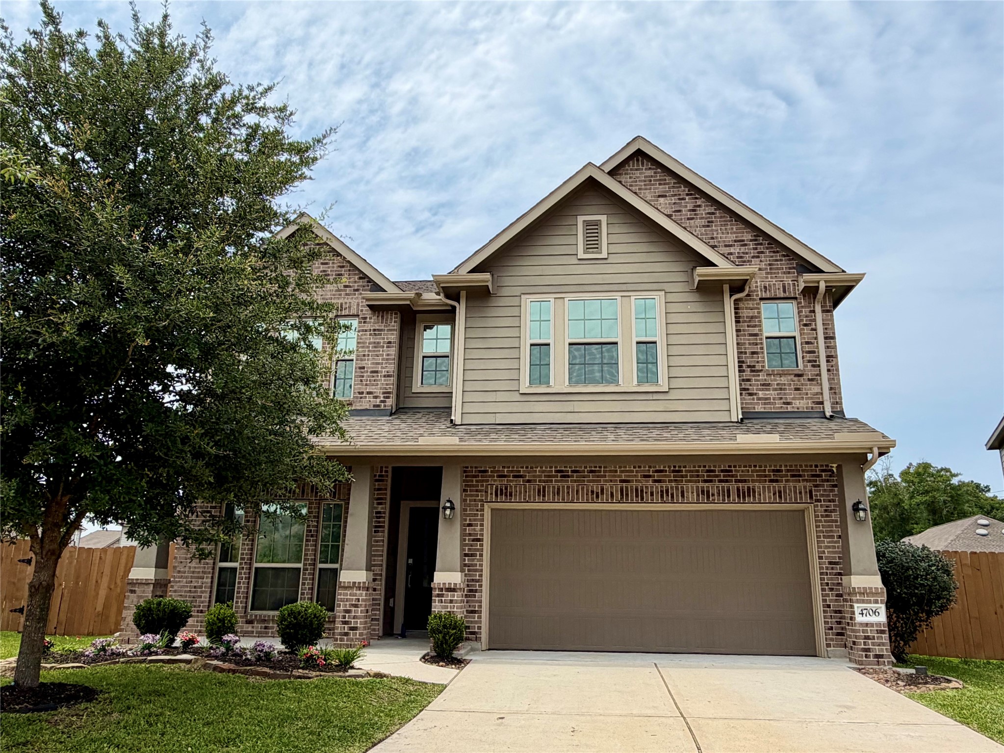 4706 Walnut Willow Ct Spring Spring, TX 77386 - Photo 2 of 17 a front view of a house with garden