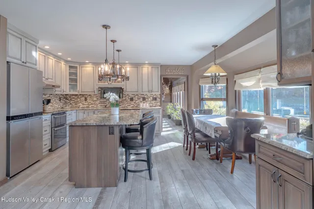 a kitchen with sink stove and cabinets