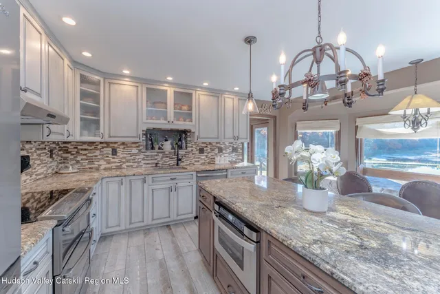 a living room with furniture wooden floor and a window