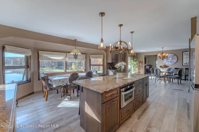 a living room with furniture a window and a fireplace