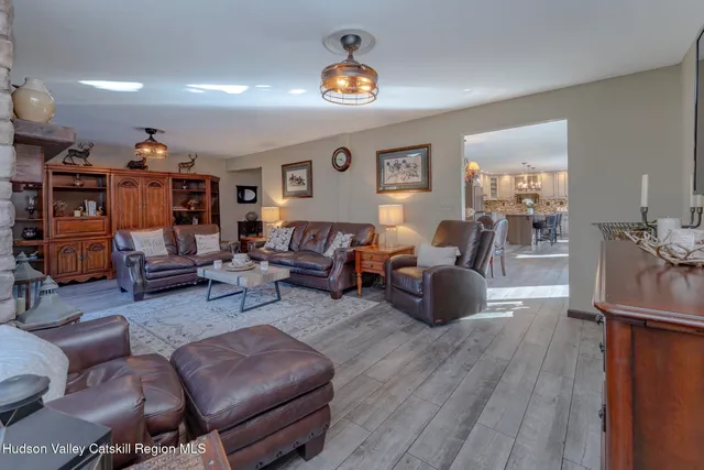 a bedroom with a bed and a tv on table