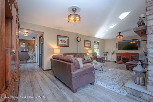a bathroom with a double vanity sink a toilet and a mirror