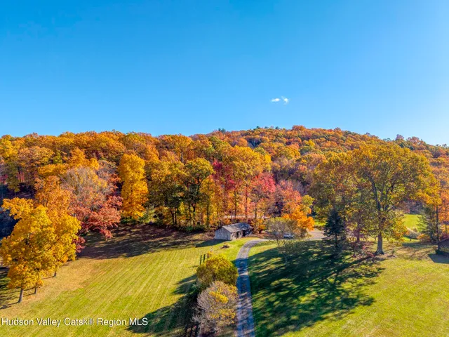 a view of a lake with houses in the background