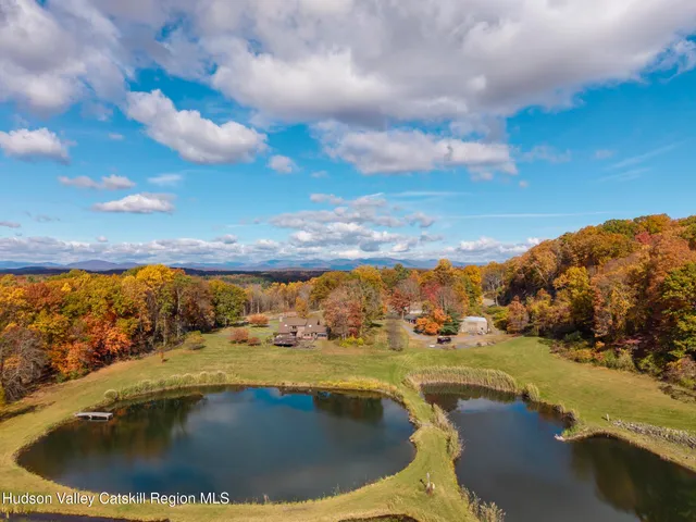 a view of a livingroom with furniture and entryway