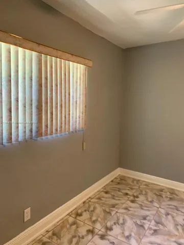 a view of a room with a window