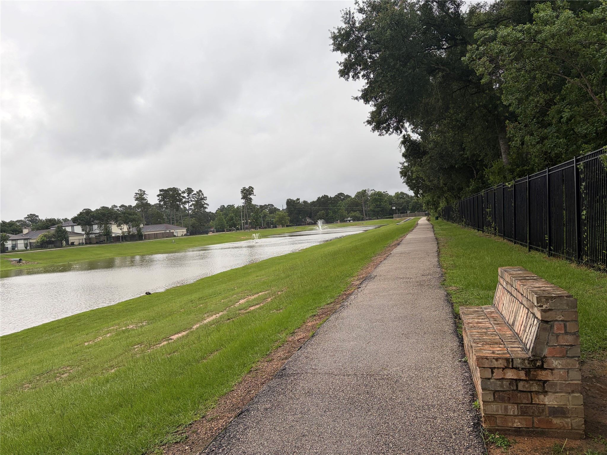 3131 Peachstone Place Spring, TX 77389 - Photo 16 of 20 a view of a lake with a garden and lake view