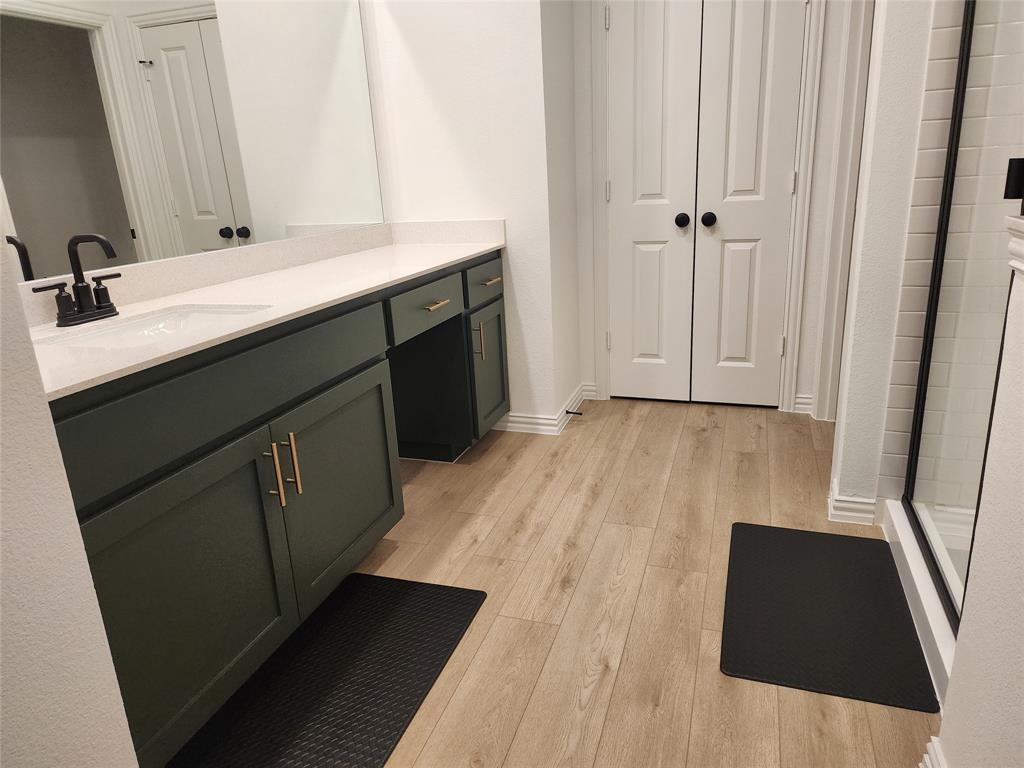 632 Blue Rdg Drive Mansfield, TX 76063 - Photo 11 of 16 a bathroom with a sink and a mirror