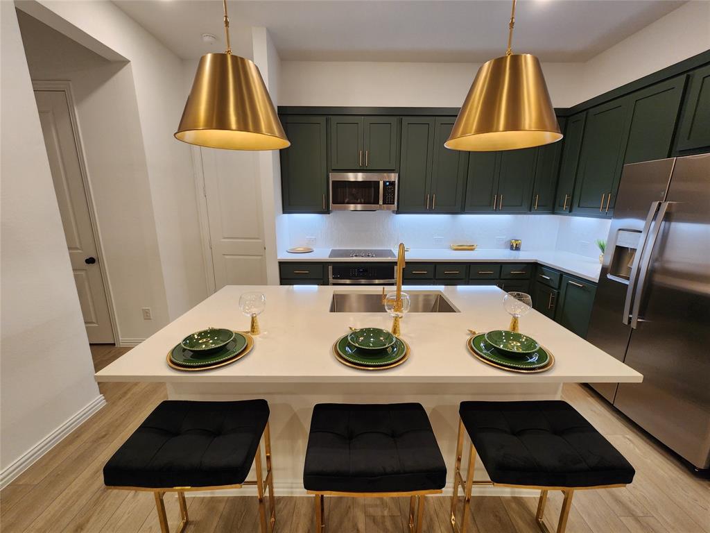632 Blue Rdg Drive Mansfield, TX 76063 - Photo 3 of 16 a table and chairs in a kitchen