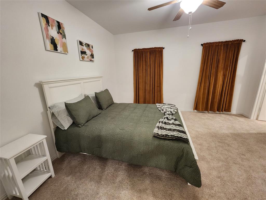 632 Blue Rdg Drive Mansfield, TX 76063 - Photo 7 of 16 a bedroom with a bed and wooden floor