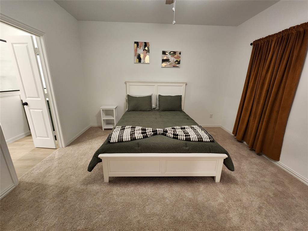 632 Blue Rdg Drive Mansfield, TX 76063 - Photo 8 of 16 a bed sitting in a bedroom next to a window