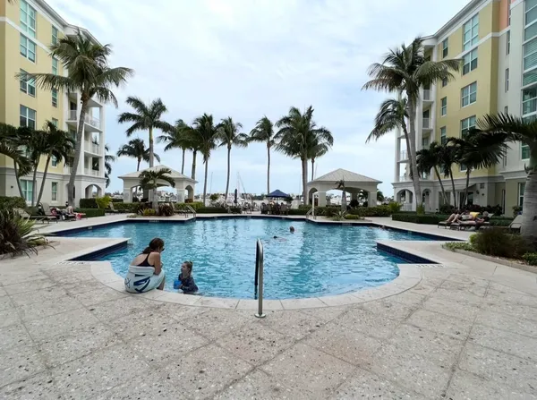 a view of swimming pool with outdoor seating