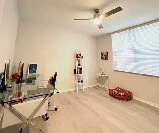 a bedroom with furniture and a wooden floor