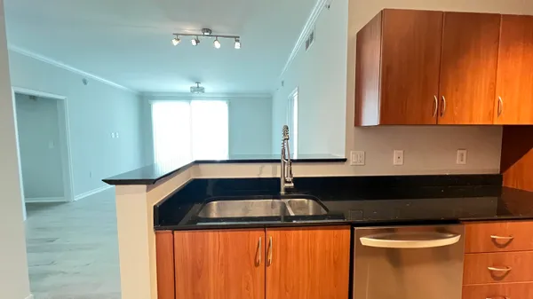 a kitchen with a sink and cabinets