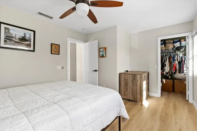 a bedroom with a bed and a walk in closet