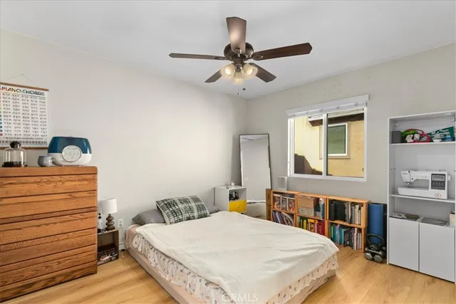 a bedroom with a bed and a dresser