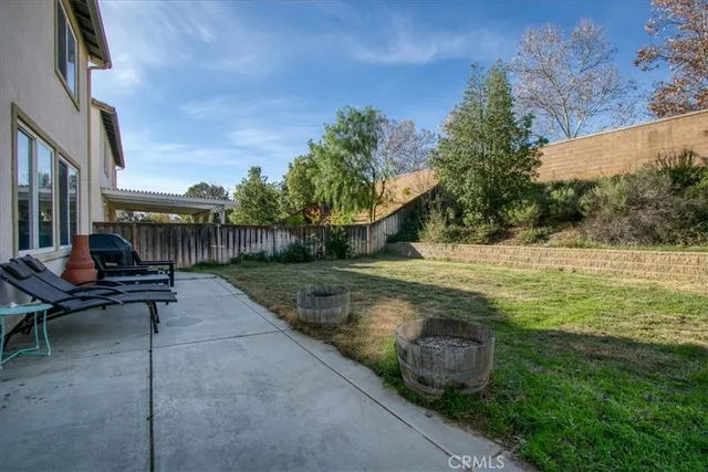 a view of a patio with chair and tables