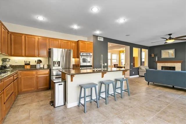 a large kitchen with a table and chairs