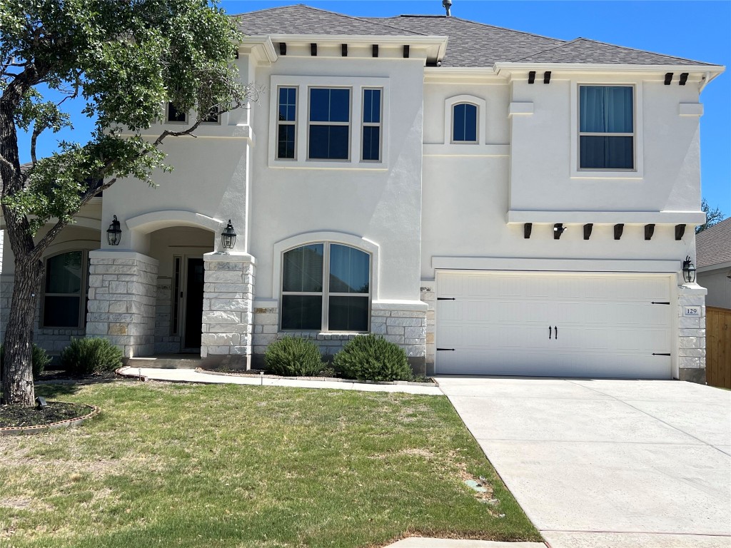 129 Red Granite Road Georgetown, TX 78633 - Photo 1 of 1 a front view of a house with yard