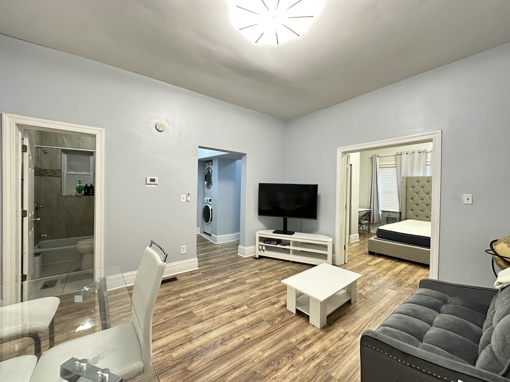 720 North Elizabeth Street, Unit 2 Chicago, IL 60642 - Photo 11 of 20 a living room with furniture and a flat screen tv