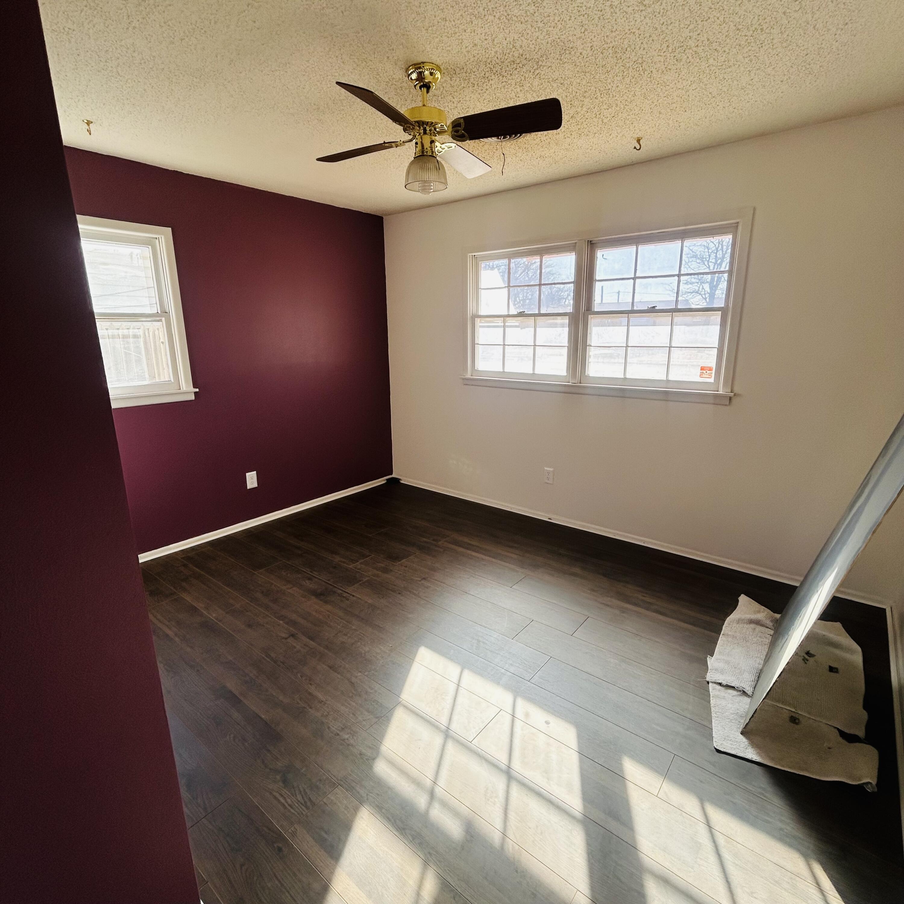 1918 71st Street Lubbock, TX 79412 - Photo 11 of 25 a view of room with window and ceiling fan